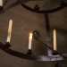 Sulle nostre teste pende infine un lampadario fatto coi cerchi di ferro di un tino dismesso e ornato di candele. Quando non cera la corrente elettrica i contadini misuravano il livello di ossigeno rimasto qui gi con laffievolirsi della fiamma 
